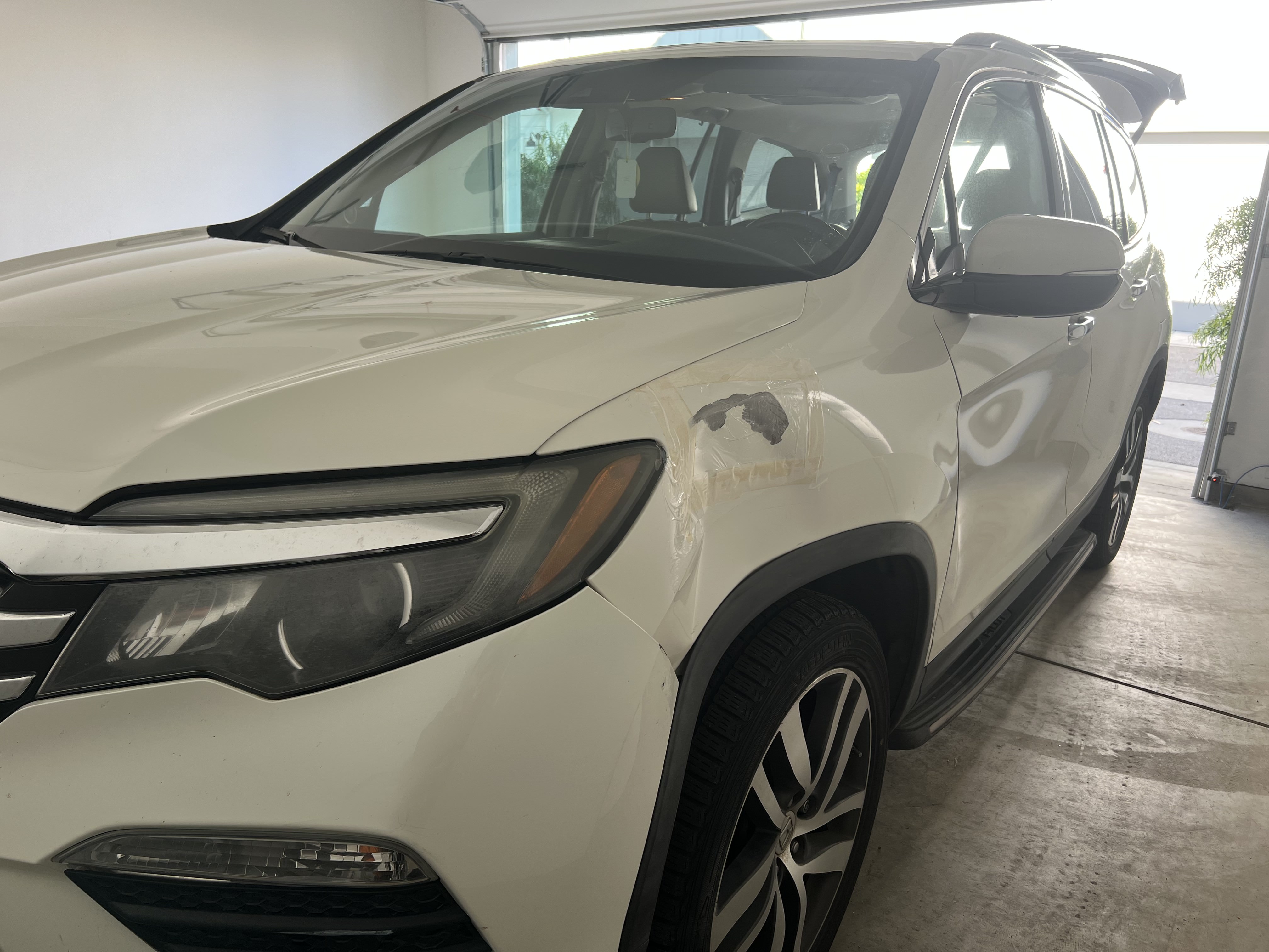 Dent repair in progress