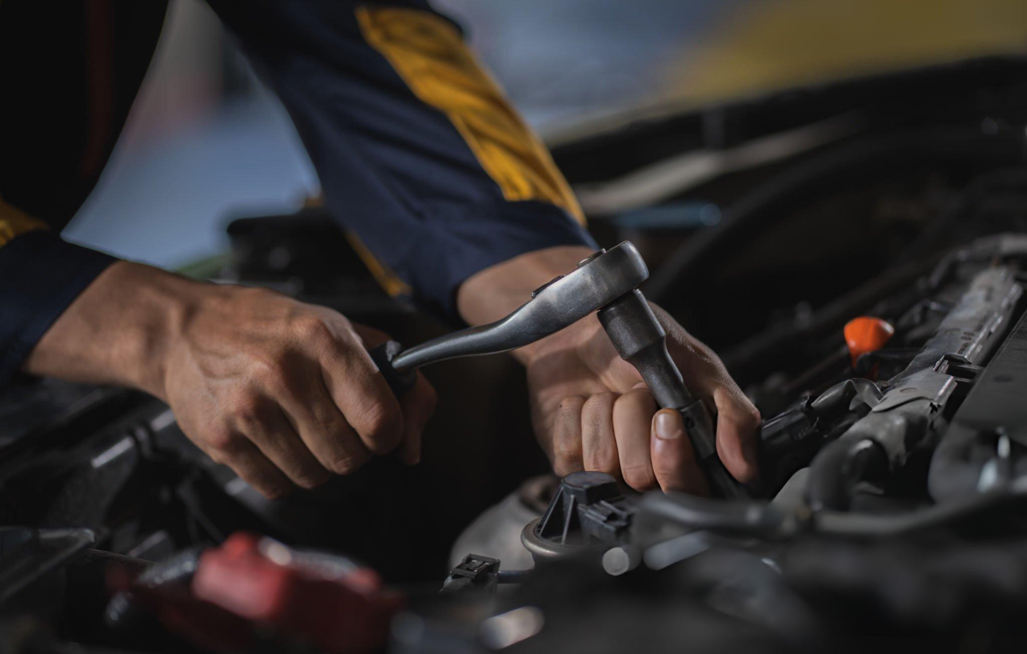 Mechanic working under the hood
